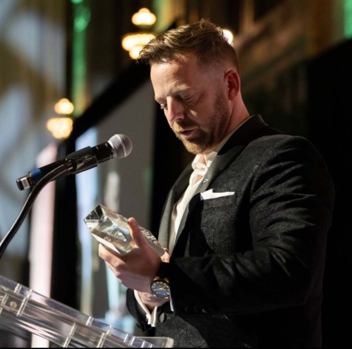 Trevor Crotts accepting an industry award